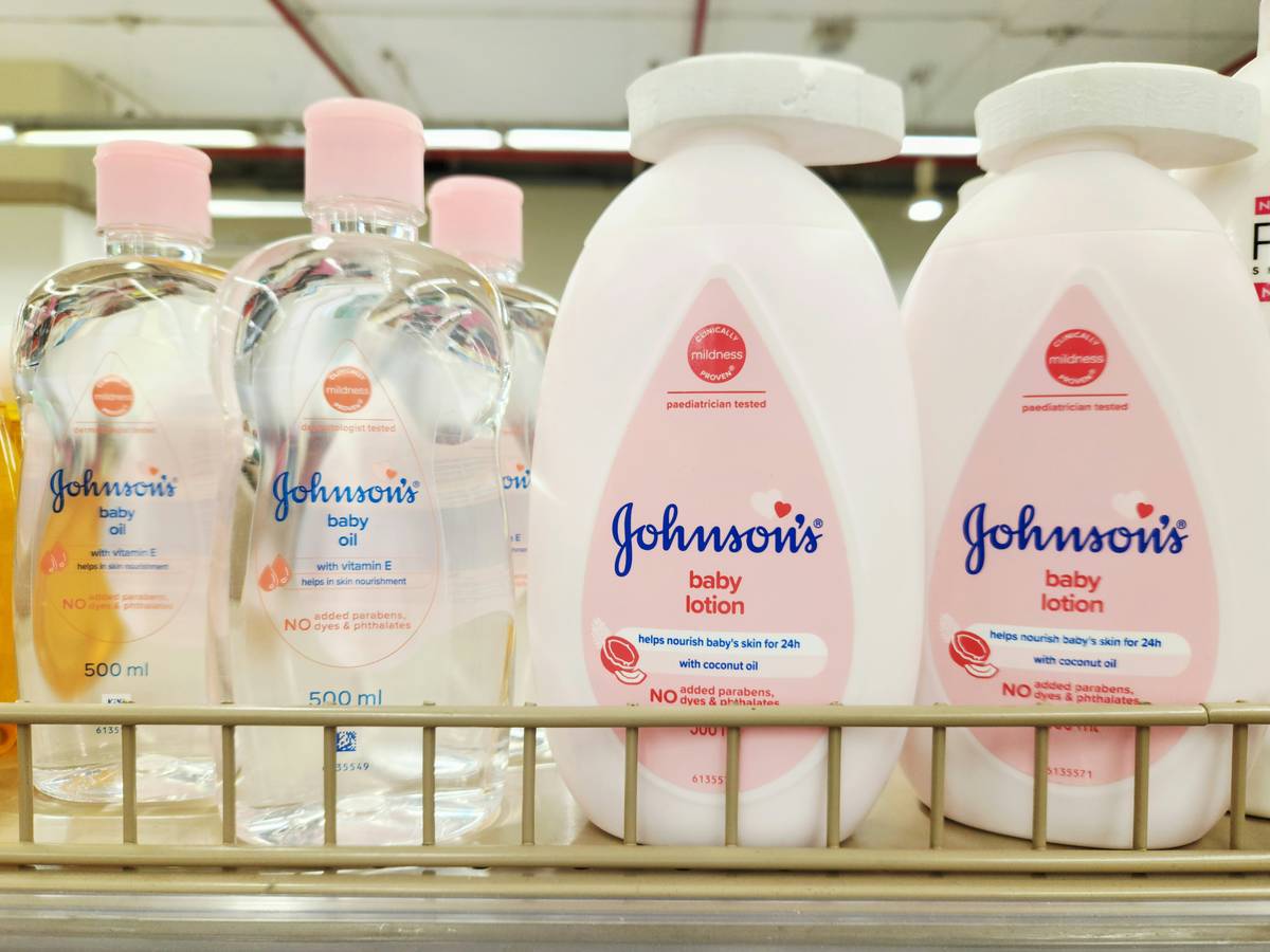 Homemade zinc oxide sunscreen mixture for newborns applied sparingly on baby's skin
